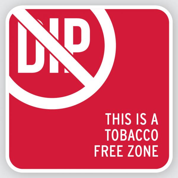 The word dip is crossed out across a red sign. The words "This is a tobacco free zone" are found in the bottom right corner.
