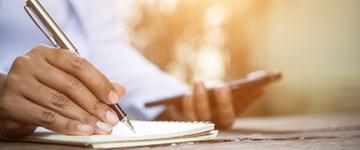 Woman writing notebook