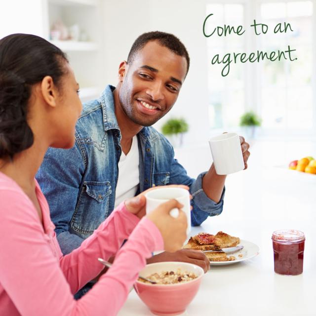 Man and woman having breakfast and talking with text saying come to an agreement
