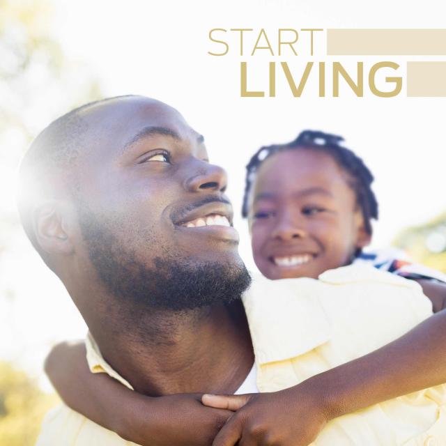 Man smiling and carrying son on back with text saying "start living"