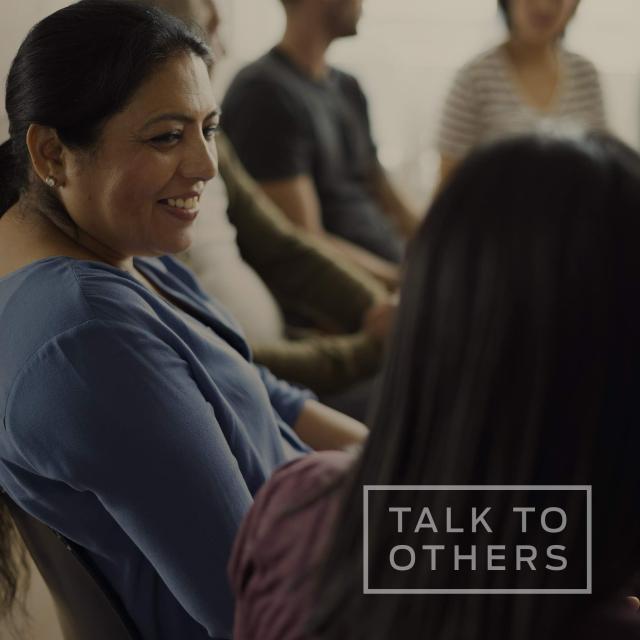 Women in support group talking with each other with text saying "talk to others"